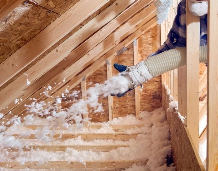 Man installing home insulation